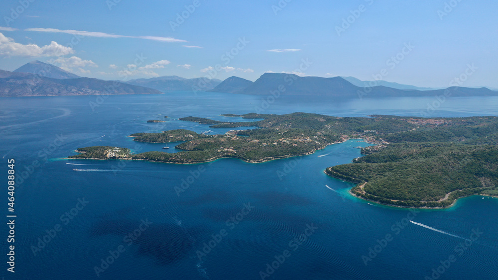 Obraz premium Aerial drone photo of fjord looking paradise bays in island of Meganisi a true sail boat and yacht calm sea anchorage protected by winds, Ionian, Greece