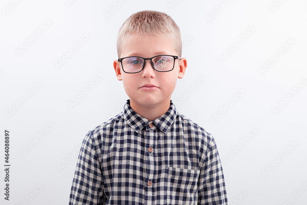 Portrait of a boy with broken glasses