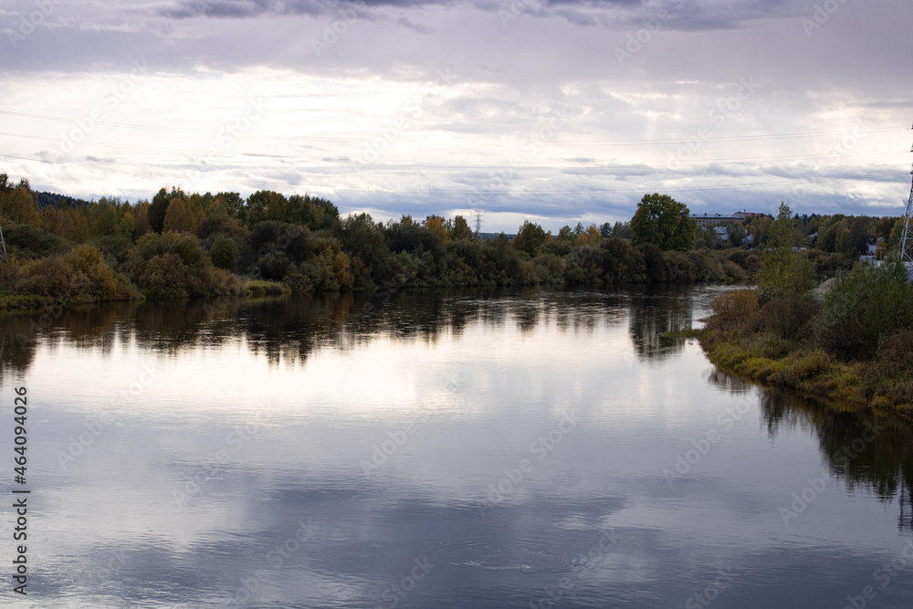 Autumn and river running through the forest