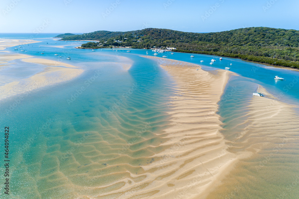 Aerial view of yachts anchored in Round Hill Creek, at the Town of 1770, QLD. Aerial view of yachts anchored in Round Hill Creek, at the Town of 1770, QLD.