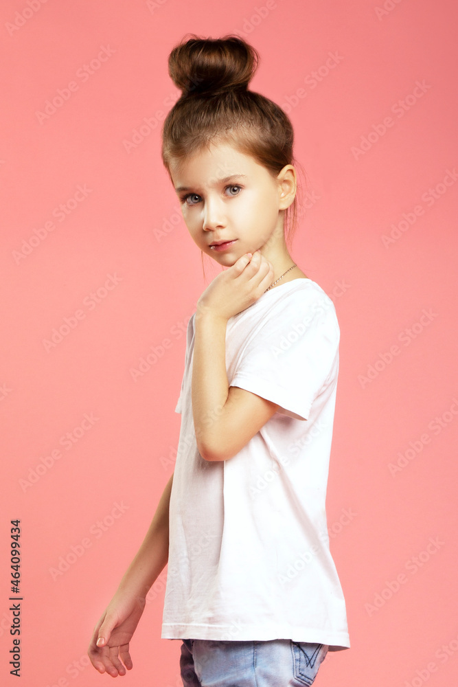 Little girl with hair style studio portrait over pink Little girl with hair style studio portrait over pink