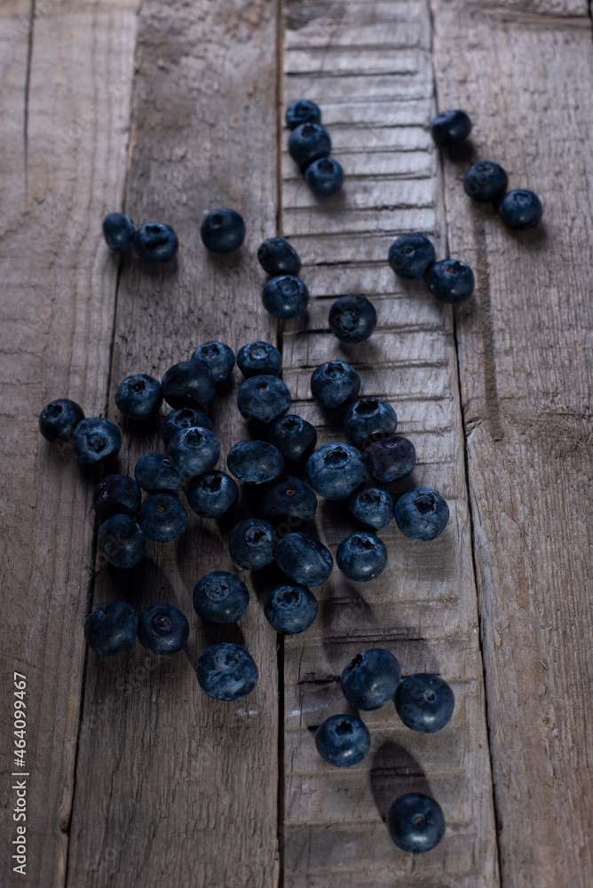 blueberries on a wooden table in a rustic style blueberries on a wooden table in a rustic style