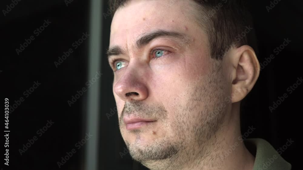 Man with Annoyed Red Blood Eye with Conjunctivitis or After Allergy, Insect Bite. Sad Male with One Red and Inflamed Eye Looking Out the Window. Allergies, Stroke, or Eye Disease Man with Annoyed Red Blood Eye with Conjunctivitis or After Allergy, Insect Bite. Sad Male with One Red and Inflamed Eye Looking Out the Window. Allergies, Stroke, or Eye Disease
