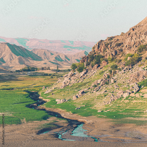 Landscape of rocky hills covered in the grass around Azat Reservoir in Armenia photo