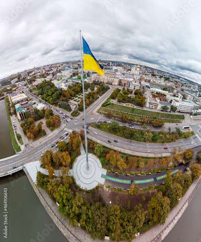 Tallest flag of Ukraine in Europe, city aerial fish eye landscape near river Lopan embankment, Skver Strilka, Dormition Cathedral in Kharkiv, Ukraine photo