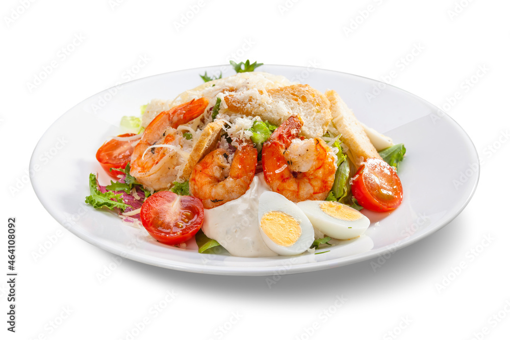 caesar salad with shrimps on a white plate, close-up, isolate caesar salad with shrimps on a white plate, close-up, isolate