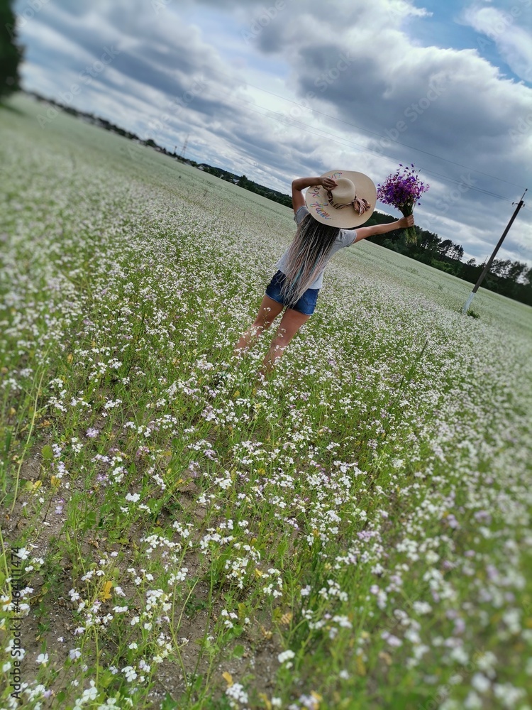 person watering flowers