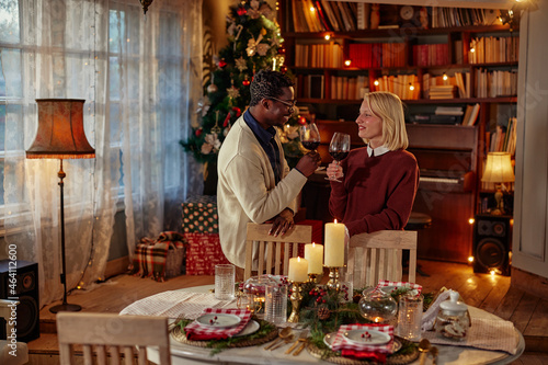 Diverse couple celebrating Christmas at home