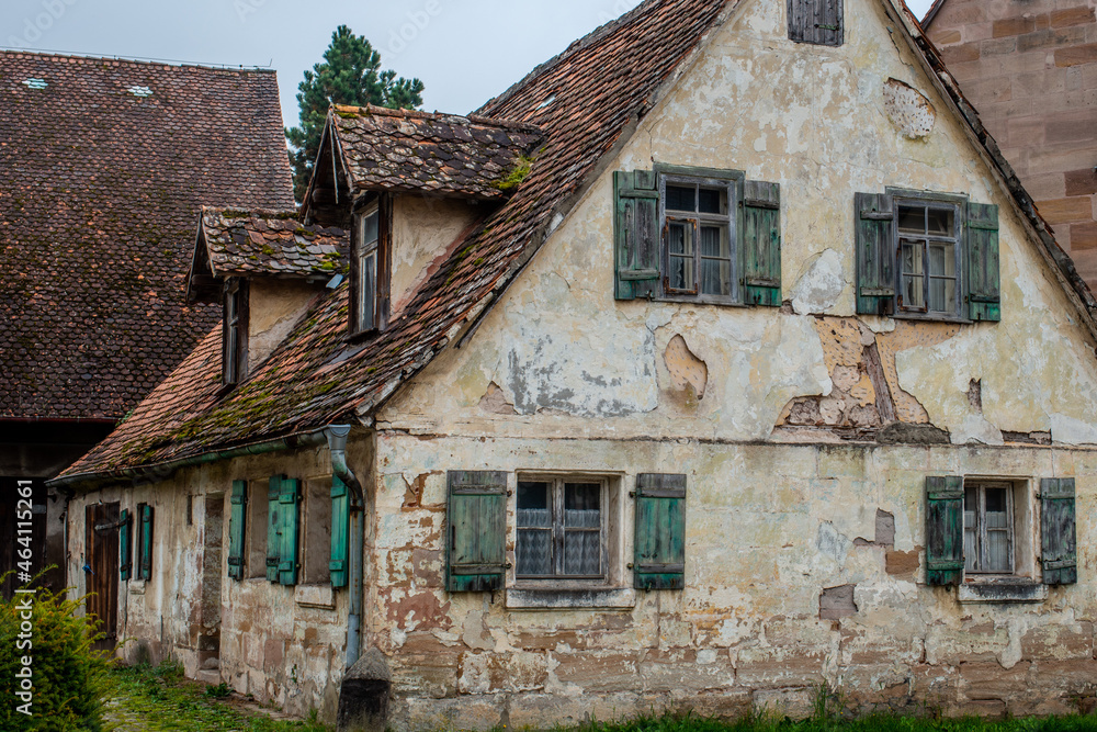 an old Franconian half-timbered house with a decayed facade 