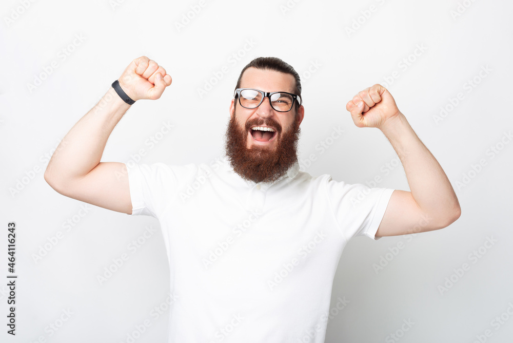 Yes I am the winner. Bearded man is gesturing over white background. Yes I am the winner. Bearded man is gesturing over white background.