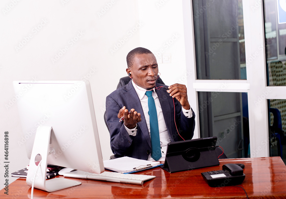 businessman working in office while making video call on digital tablet.