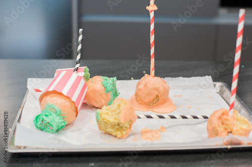 Giant Sweet Cupcake Cake Pop with Green Frosting and pink chocolate and multi colored Sprinkles