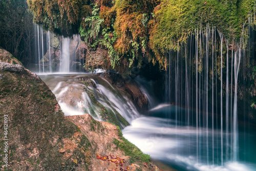 Forest in autumn with long exposure waterfall in bejis  valencia. Brown  green