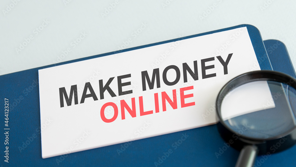 make money online word on paper and magnifying lens make money online word on paper and magnifying lens