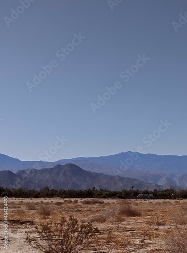 Deseet landscape with mountain background and clear blue skies 