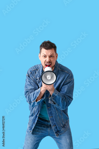 Protesting man with megapho...
