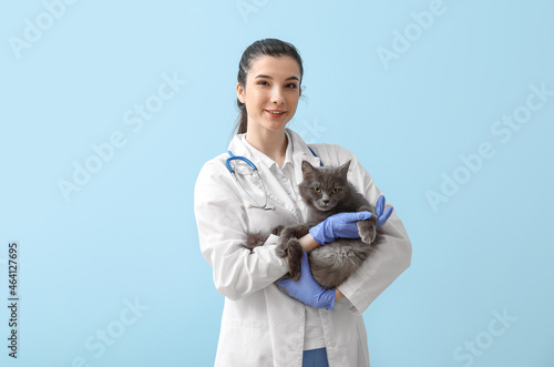 Female veterinarian holding...