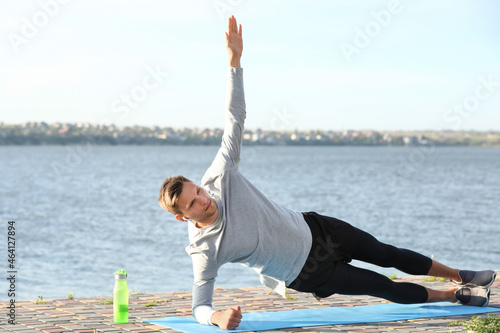 Sporty young man doing plan...