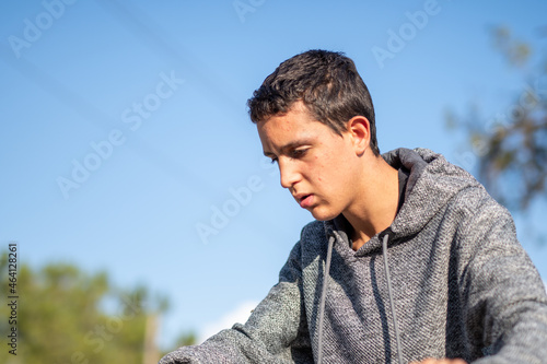 Half body photo of latin teenage boy with black hair