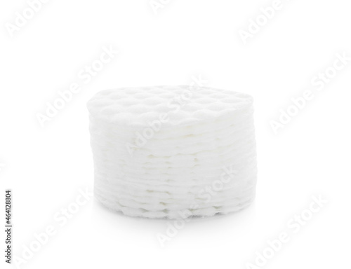 Stack of clean cotton pads on white background