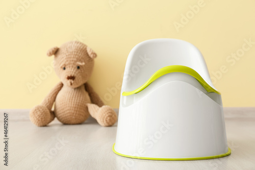 Potty and cute toy bear on ...