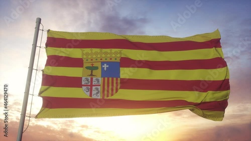 Aragon flag, Spain, waving in the wind, sky and sun background photo