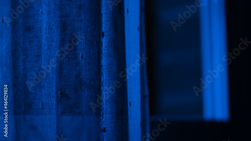 Blue window with light coming throw. Blue lightcoming in. Night. Moonlighty. © Red