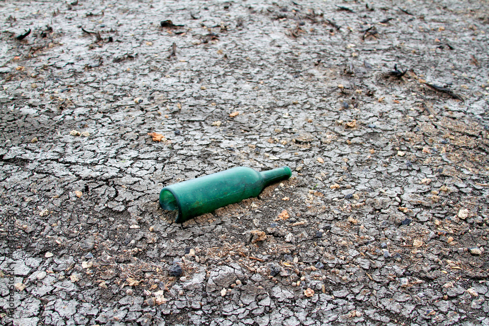 old green bottle abandoned in the drought old green bottle abandoned in the drought
