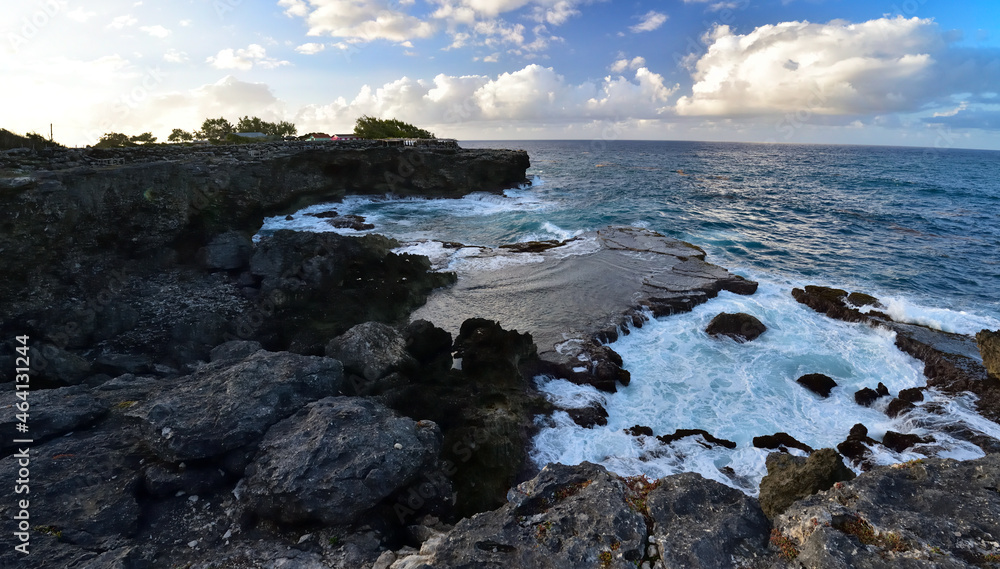 Rough ocean waves crashing against the rocky cliffs of North Point, Barbados, Caribbean Rough ocean waves crashing against the rocky cliffs of North Point, Barbados, Caribbean