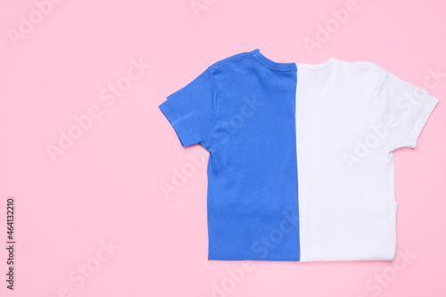 Blue and white t-shirts on pink background