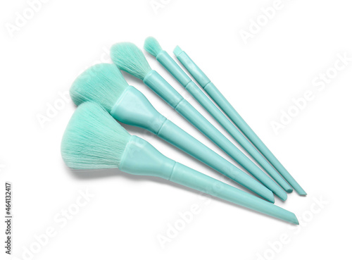 Set of stylish makeup brushes on white background