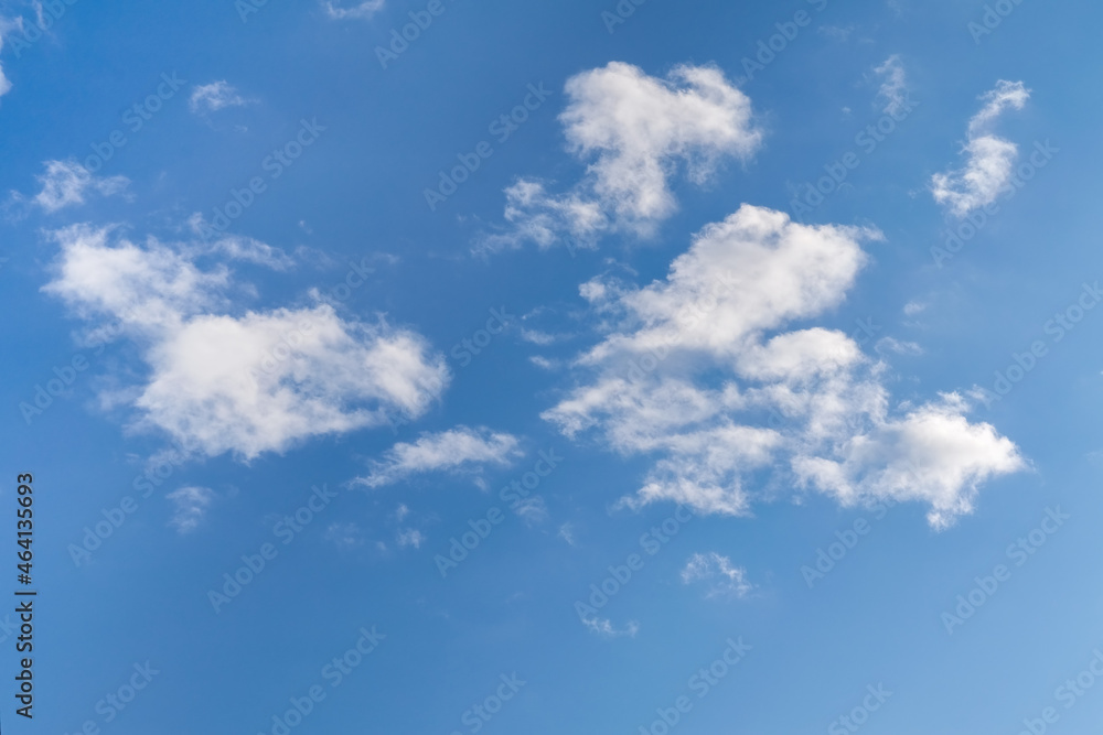 Blue summer sky with white cumulus clouds. Blue sky with clouds nature background. Blue summer sky with white cumulus clouds. Blue sky with clouds nature background.