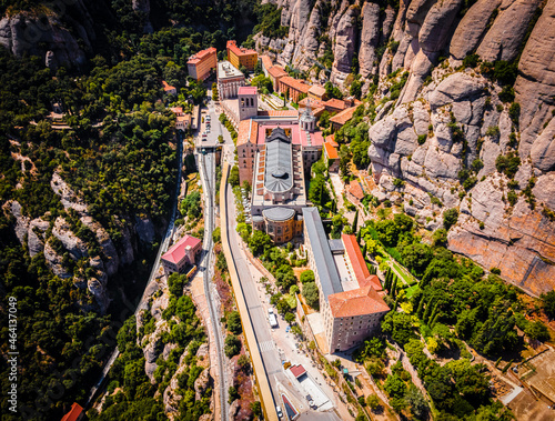 The aerial view of Santa Maria de Montserrat, an abbey of the Order of Saint Benedict located on the mountain of Montserrat in Monistrol de Montserrat, Catalonia, Spain photo