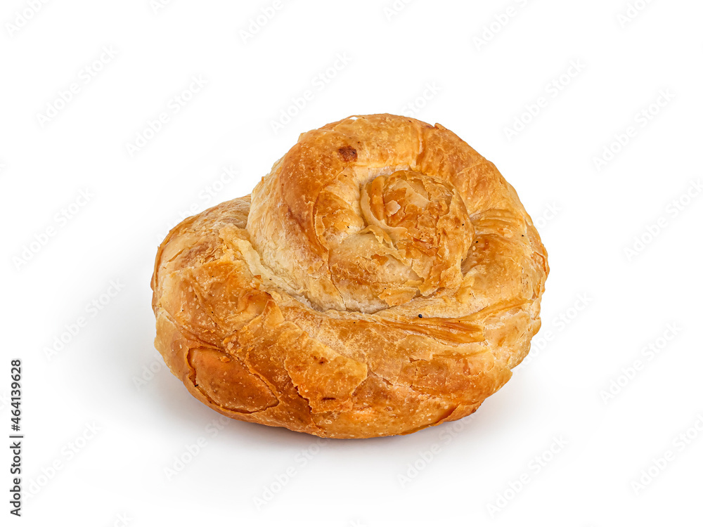 Snail bun made of puff pastry with a golden crust on white Snail bun made of puff pastry with a golden crust on white