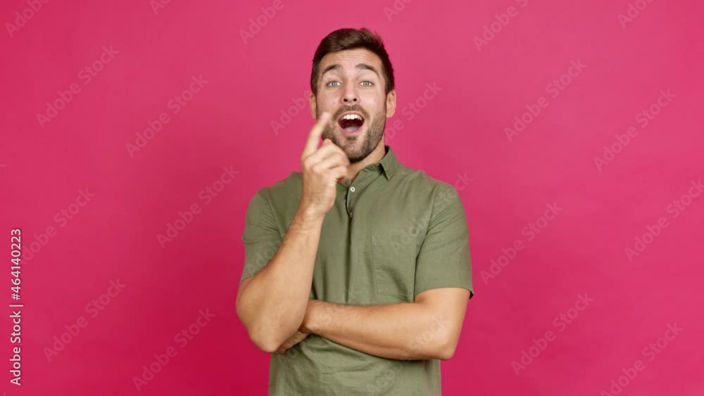 Handsome man standing and thinking an idea pointing the finger up over isolated background Handsome man standing and thinking an idea pointing the finger up over isolated background