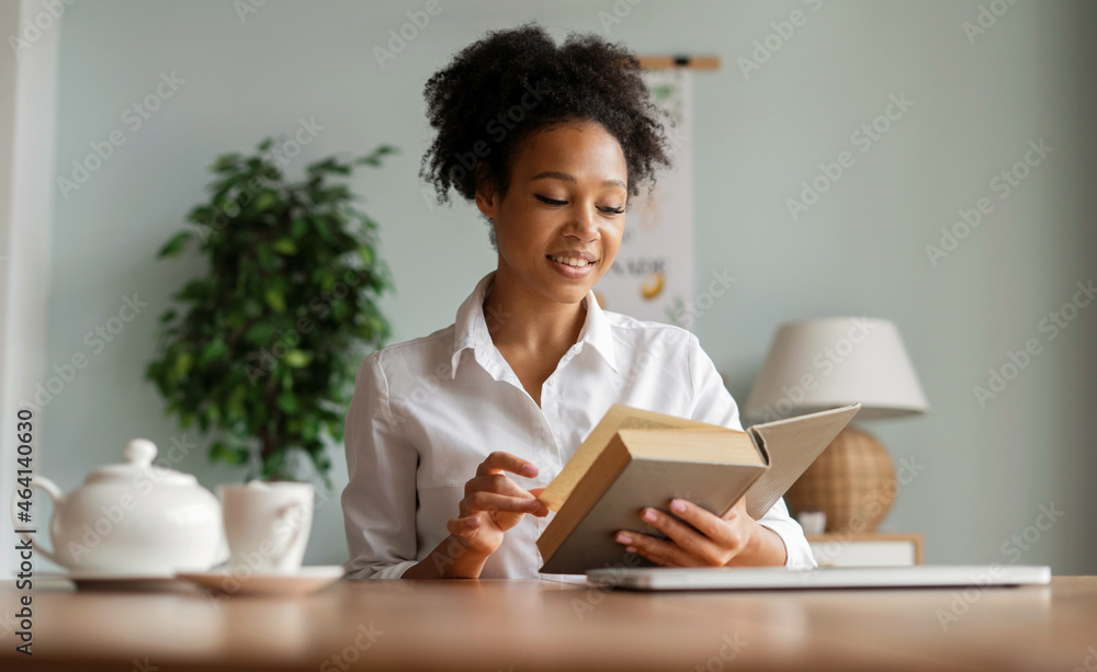 A freelancer is looking for information in the literature. A female student is reading a thick book. The blogger works at home. A freelancer is looking for information in the literature. A female student is reading a thick book. The blogger works at home.