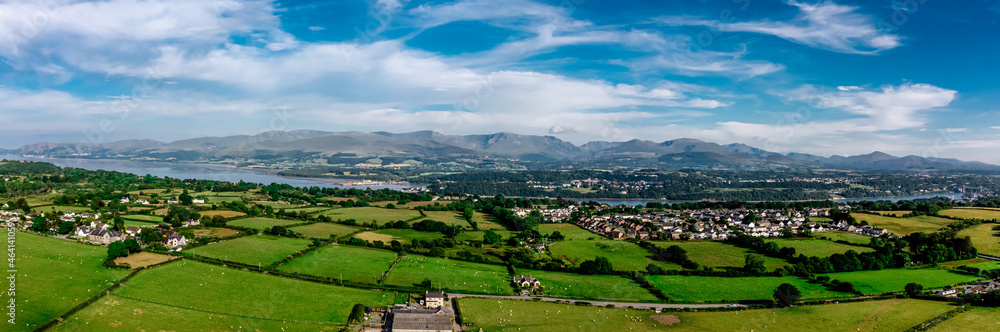 Aerial view of snowdonia landscape in the distance from Anglesey