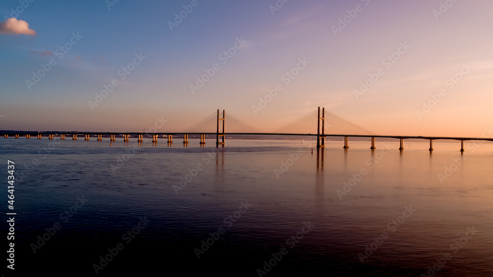 Aerial view of prince of wales Severn bridge connecting england and wales during susnet golden hour Aerial view of prince of wales Severn bridge connecting england and wales during susnet golden hour