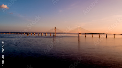 Aerial view of prince of wales Severn bridge connecting england and wales during susnet golden hour photo