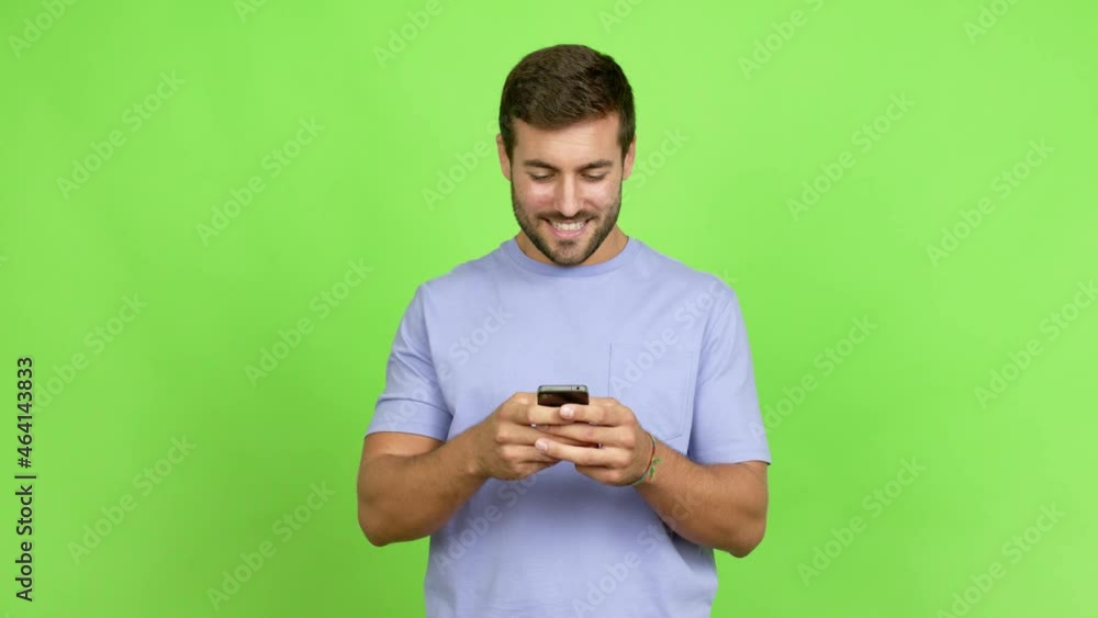Handsome man man keeping a conversation with the mobile phone over isolated background Handsome man man keeping a conversation with the mobile phone over isolated background