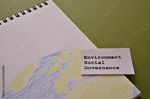 A card labeled "Environment, Social, Governance" is placed over a green background.