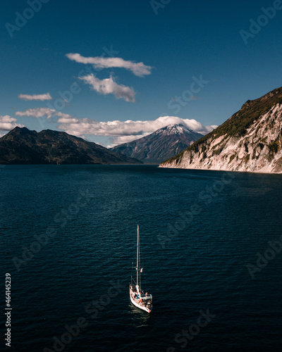 yacht on the background of the volcano
