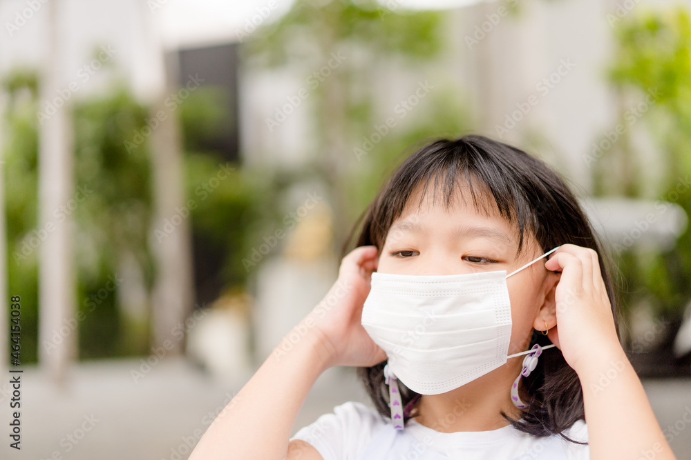 Coronavirus Covid-19.Back to school Stay safe.Asian korean child girl kid wearing mask for protect and exercise in the park.School kid outdoor wearing mask.portrait kid girl.people healthcare.sick. Coronavirus Covid-19.Back to school Stay safe.Asian korean child girl kid wearing mask for protect and exercise in the park.School kid outdoor wearing mask.portrait kid girl.people healthcare.sick.
