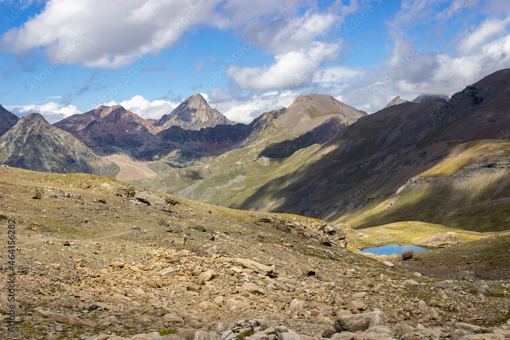 Hiking trail in Cogne valley, Aosta, Italy. Second lake of Doreire in the high walloon of Grauson near the pass of Invergneux. Photo taken at 2900 meters of altitude.