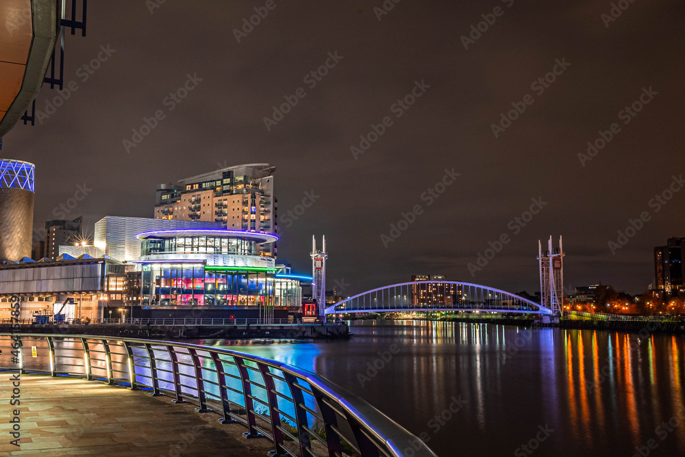Salford, England. October 10, 202. The Lights Of Manchester Ship Canal. Night view of the Manchester business center. City lights.