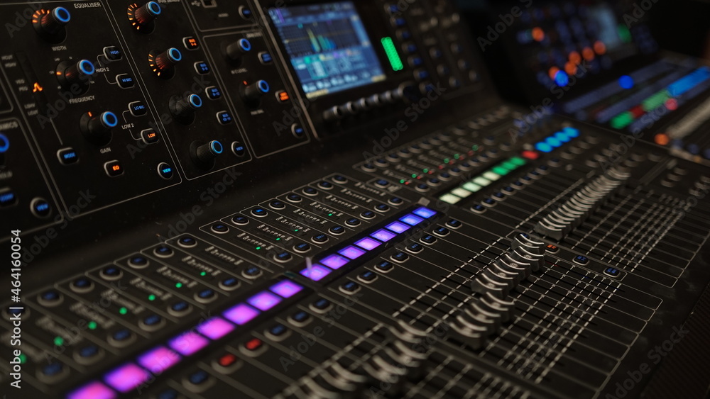 Black digital audio mixer. Focus selected on the slider button