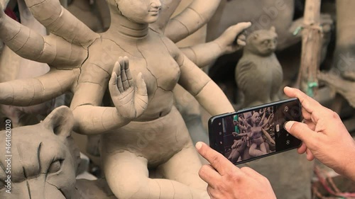 Kolkata, India : Incomplete idol of Goddess Saraswati; idol dried for further processing like colouring and ornamentation before the Durga Puja festivities. photo