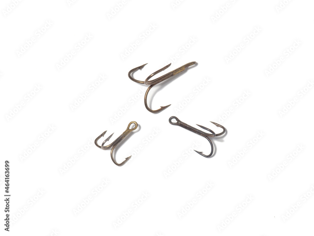 Triple hooks on a white background. Fishing. Triple hooks on a white background. Fishing.