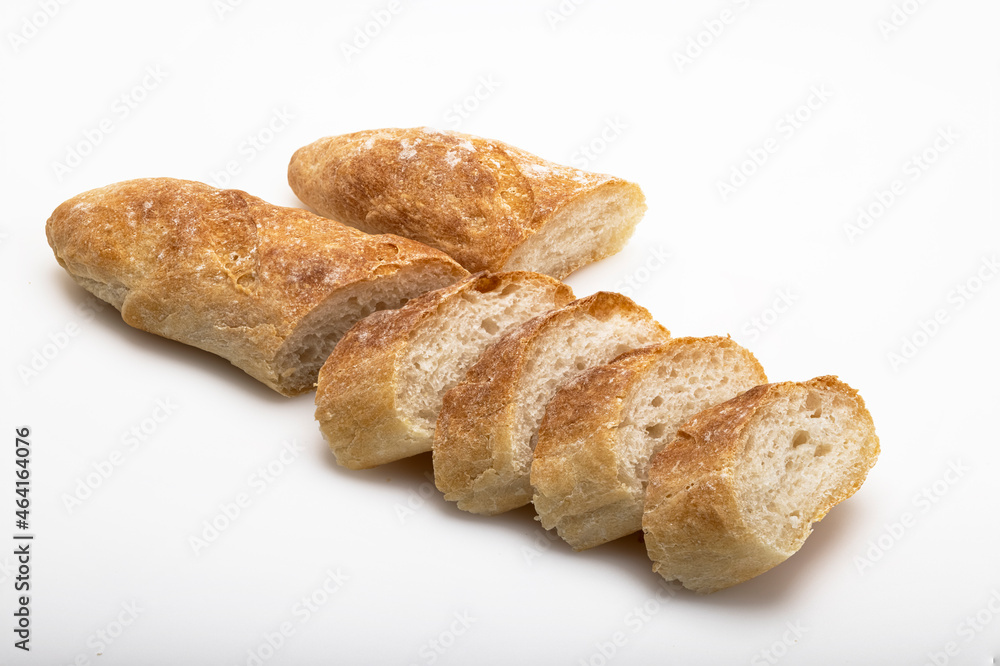 French freshly baked baguette and sliced baguette path isolated on white background
