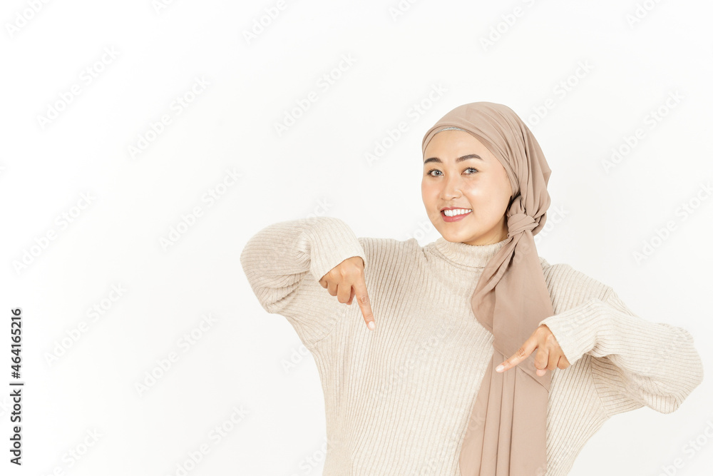 Presenting and Pointing Down of Beautiful Asian Woman Wearing Hijab Isolated On White Background Presenting and Pointing Down of Beautiful Asian Woman Wearing Hijab Isolated On White Background